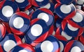 Laos Badges Background - Pile of Laotian Flag Buttons.