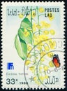 LAOS - CIRCA 1988: stamp shows flowering plant Danaus chrysippus