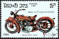 LAOS - CIRCA 1985: A stamp printed in Laos from the `Centenary of Motorcycle` issue shows an Indian Chief, 1930, circa 1985. Royalty Free Stock Photo