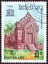 LAOS - CIRCA 1986: A stamp printed in Laos shows Vat Phou Temple and UNESCO emblem, circa 1986.