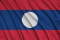 Laos flag is depicted on a sports cloth fabric with many folds. Sport team banner