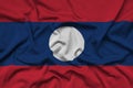 Laos flag is depicted on a sports cloth fabric with many folds. Sport team banner