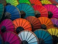 Laos, Luang Prabang. Umbrellas made of paper of different colors