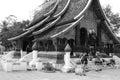 Laos: roof repair at Wat Xieng Thong temple in Luang Brabang City