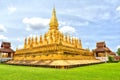 Laos travel landmark, golden pagoda wat Phra That Luang in Vientiane. Buddhist temple. Famous tourist destination in Asia.