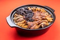 Lap mei fan or waxed meat rice with red on red background. It is Chinese traditional dish that is served during Chinese