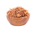 Lapacho herbal tea in wooden bowl, isolated on white background. Natural Taheeboo dry tea. Pau d'arco herb. Tabebuia