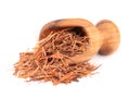 Lapacho herbal tea in wooden scoop, isolated on white background. Natural Taheeboo dry tea. Pau d'arco herb. Tabebuia