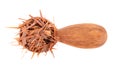 Lapacho herbal tea in wooden spoon, isolated on white background. Natural Taheeboo dry tea. Pau d'arco herb. Tabebuia