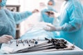 Laparoscopic instruments with medical workers on blurred background Royalty Free Stock Photo