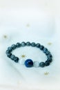 Lapis lazuli bead and Labradorite Crystal lucky stone bracelet bead on white towel background.fashion with believe in Add charm,pr Royalty Free Stock Photo