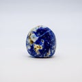 Lapis Lazuli. Beautiful blue lapis lazuli gem stone isolated Royalty Free Stock Photo