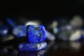 Lapis Lazuli Is a natural gemstone with a beautiful blue color on the wood floor