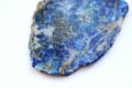 Lapis lazuli stone tile top view on white background Royalty Free Stock Photo