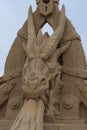 Sand sculpture - chained dragon. Front view. Close-up Royalty Free Stock Photo