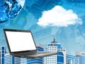 Laptop on abstract cityscape background with cloud