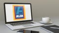 Laptop with Aldi logo on the screen. Modern workplace conceptual editorial 3D rendering Royalty Free Stock Photo