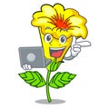 With laptop allamanda flower in the shape cartoon