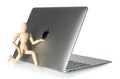 Laptop Apple MacBook Air M1 13-inch with wooden manikin on white background