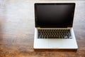 Laptop with black blank screen on a wooden desk	, home office concept, copy space Royalty Free Stock Photo