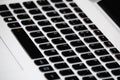 Laptop with black keyboard on white background