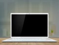 Laptop with a black screen on the desk of the workplace. Royalty Free Stock Photo