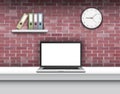 Laptop with blank screen on desk in home interior. Royalty Free Stock Photo