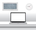 Laptop with blank screen on desk in minimalistic office interior. Royalty Free Stock Photo