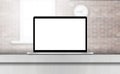 Laptop, with blank screen on desk in office interior. Royalty Free Stock Photo