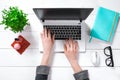 Laptop with blank screen and girl`s hands. Flat lay, top view workspace Royalty Free Stock Photo