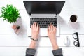 Laptop with blank screen and girl`s hands. Flat lay, top view workspace Royalty Free Stock Photo