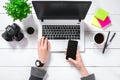 Laptop with blank screen and girl`s hands. Flat lay, top view workspace Royalty Free Stock Photo