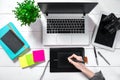 Laptop with blank screen and girl`s hands. Flat lay, top view workspace Royalty Free Stock Photo