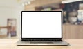 Laptop blank screen on wood table with coffee cafe background Royalty Free Stock Photo