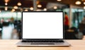 Laptop blank screen on wood table with coffee cafe background Royalty Free Stock Photo
