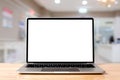 Laptop blank screen on wood table with hospital or clinic background, mockup, template Royalty Free Stock Photo