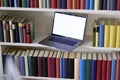 Laptop and books from above with reflections Royalty Free Stock Photo