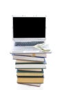 Laptop,books and dollars isolated on a white Royalty Free Stock Photo