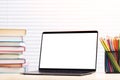 Laptop, books and pencils on desk Royalty Free Stock Photo
