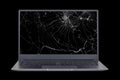 laptop with a broken  cracked screen isolated on black background close up Royalty Free Stock Photo