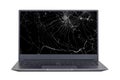 Laptop with a broken, cracked screen isolated on white background close up front view. Royalty Free Stock Photo