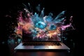 Laptop bursting with an explosion of vibrant colours Royalty Free Stock Photo