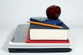 Laptop, calculator, books, apple and pencil Royalty Free Stock Photo