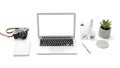 Laptop with camera notebook and plant on a white background computer desk Royalty Free Stock Photo