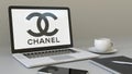 Laptop with Chanel logo on the screen. Modern workplace conceptual editorial 3D rendering