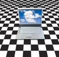 Laptop On Checker Board Royalty Free Stock Photo