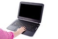 Laptop with a child`s hand on the keyboard on a white background Royalty Free Stock Photo