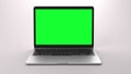Laptop with chroma key on display for mock ups, promotion or website showcase.