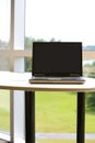 Laptop with clipping path in modern office.