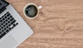 Laptop and coffee mug on wooden office desk, top view, copy space, 3d rendering Royalty Free Stock Photo